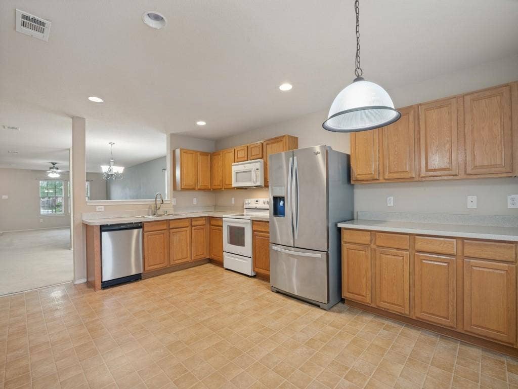 Plenty of counter-top space, extensive cabinetry, and double sink.