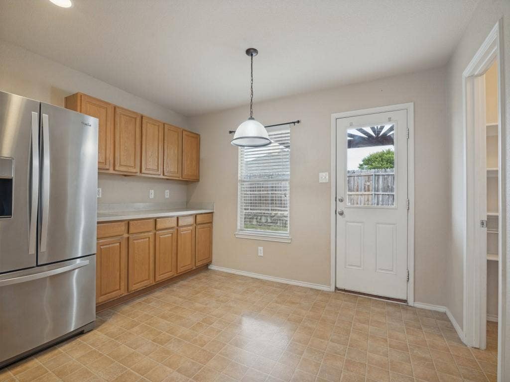 Bright breakfast area with backyard access and nearby walk-in pantry.