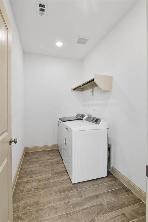 3125 Lucia Way, Princeton, TX 75407 Dedicated laundry area featuring wood-finish tile flooring and built-in shelving