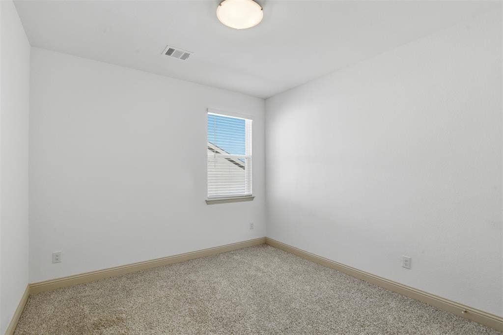 3125 Lucia Way, Princeton, TX 75407 Neutral-toned wall-to-wall carpeting, single-pane window with horizontal blinds, and flush-mount ceiling light fixture