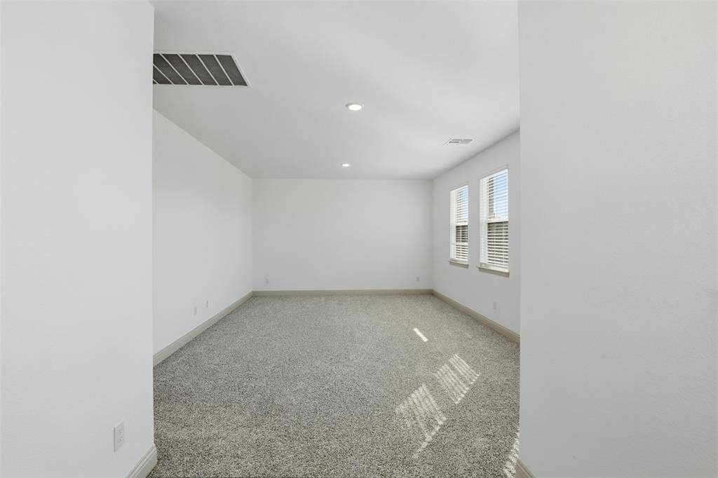 3125 Lucia Way, Princeton, TX 75407 Neutral interior space featuring carpeted flooring, recessed lighting, and dual windows