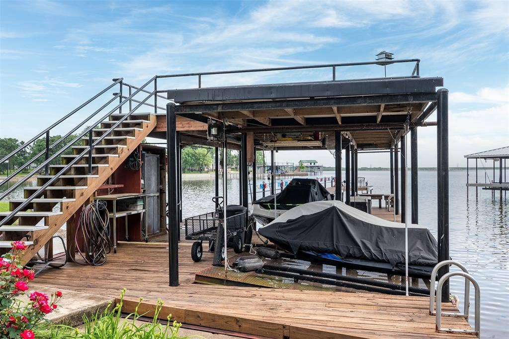 Boat House With Double Jet Ski Lift, Boat Lift, & Party Deck