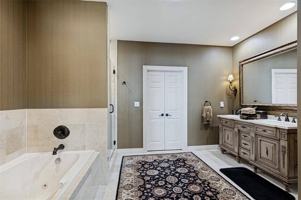 2828 Hood Street, #508, Dallas, TX 75219 Beautifully appointed bathroom with dual vanities and custom cabinetry.