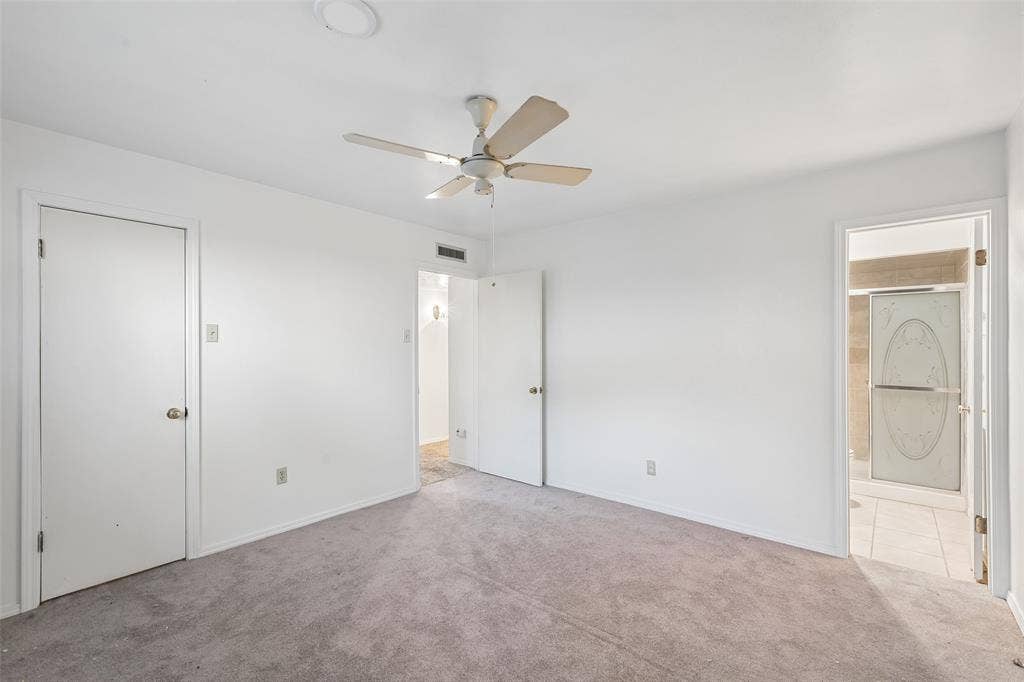3309 S Edelweiss Drive, Grand Prairie, TX 75052 A bedroom with its own bath next door.