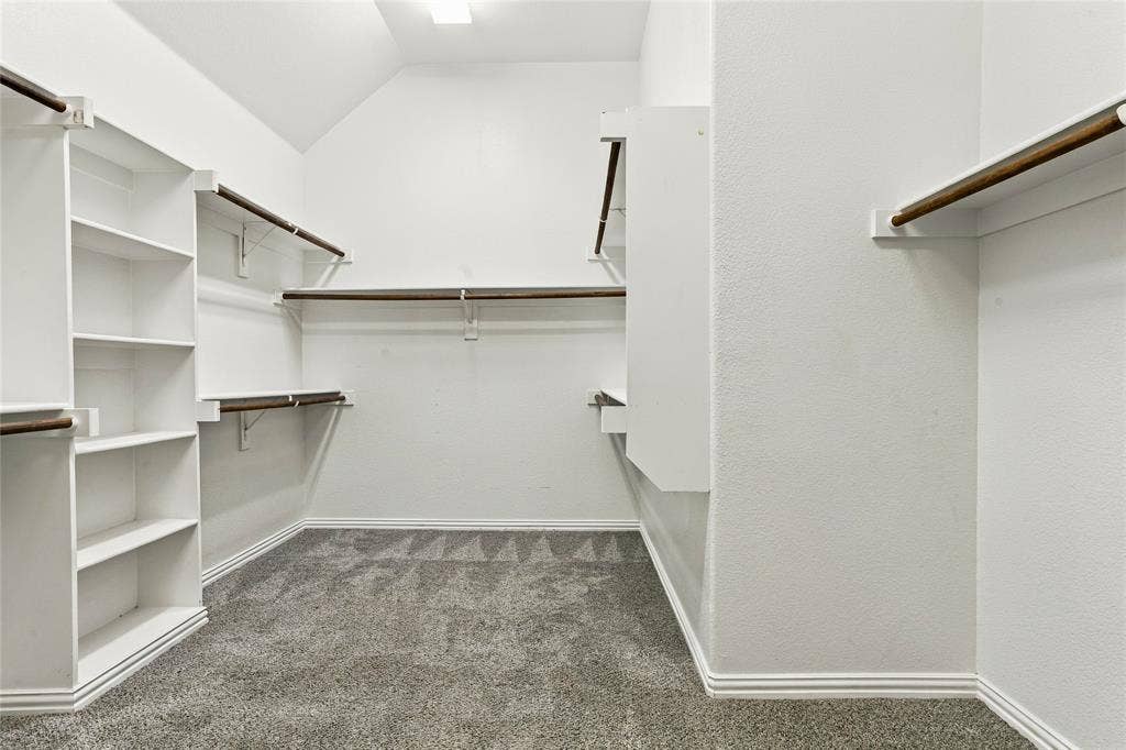 104 Aztec Court, Waxahachie, TX 75165 Walk-in closet in primary suite has plenty of space with buitin shelves.