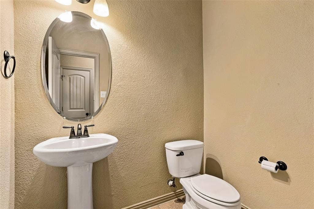 104 Aztec Court, Waxahachie, TX 75165 Half bath on first floor for guests.