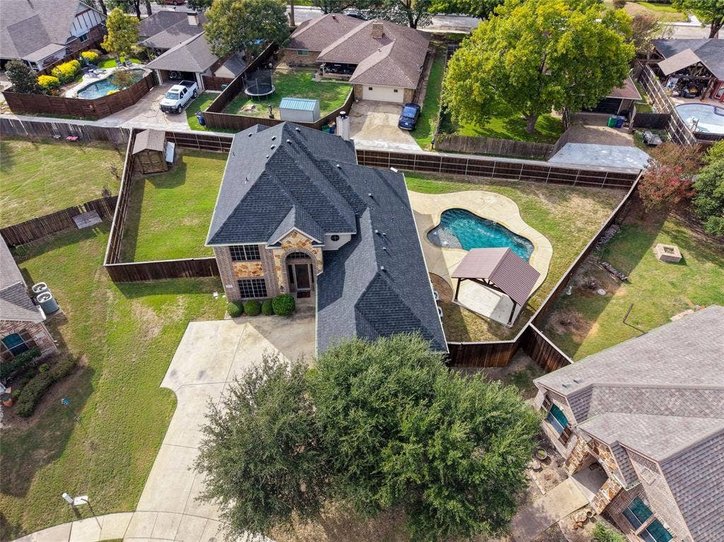 104 Aztec Court, Waxahachie, TX 75165 A beautiful home on .27 acres with a pool, storage shed, room to entertain and play!