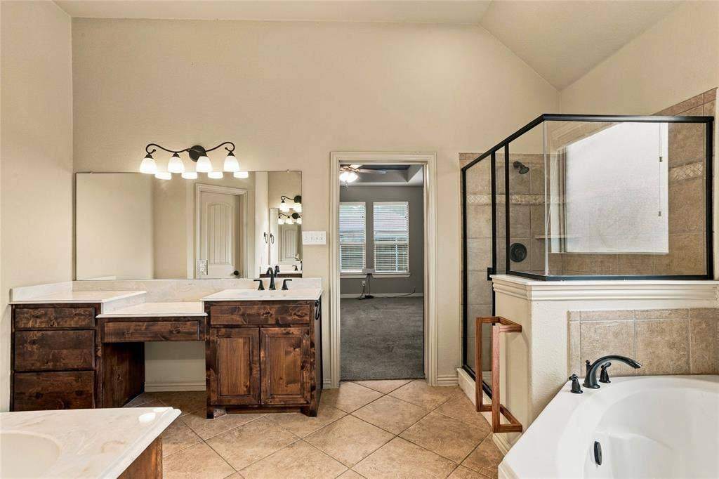 104 Aztec Court, Waxahachie, TX 75165 Ensuite primary bath with separate vanities.