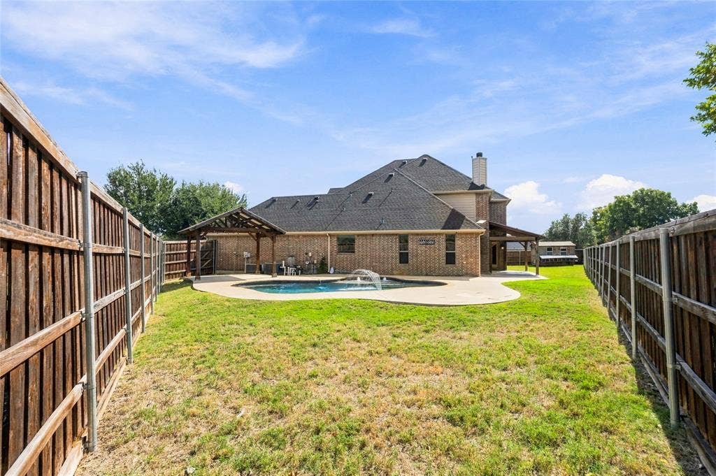 104 Aztec Court, Waxahachie, TX 75165 Large yard area surrounds the pool.