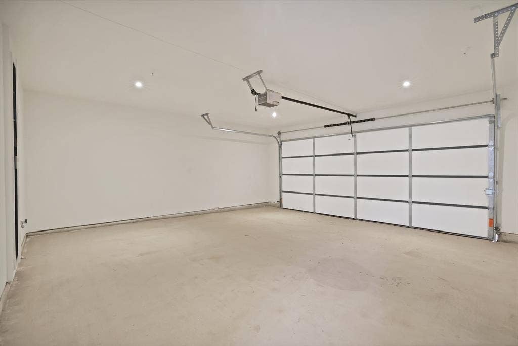 1731 N Fitzhugh Avenue, Dallas, TX 75204 Garage featuring a garage door opener
