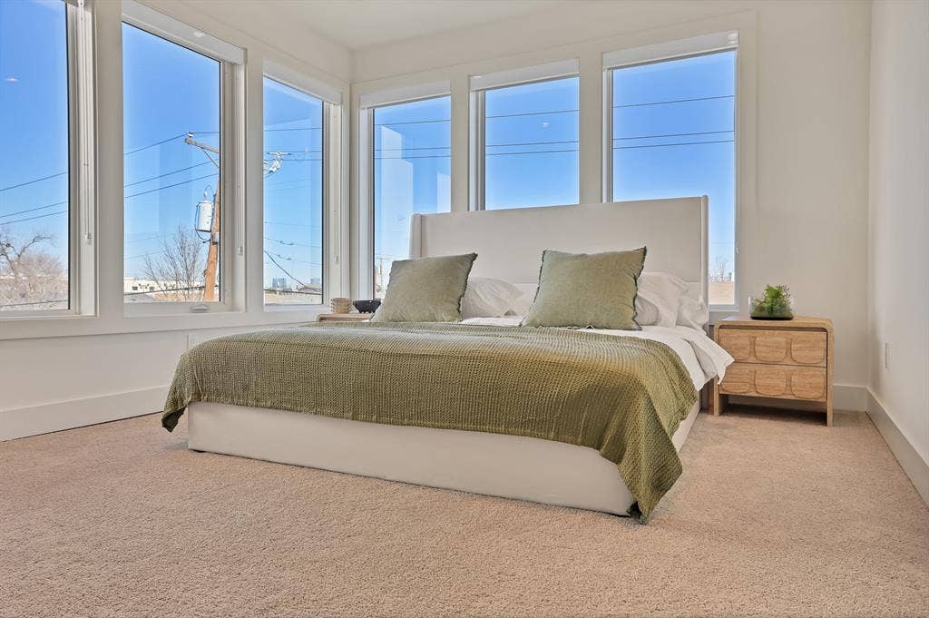 1731 N Fitzhugh Avenue, Dallas, TX 75204 Carpeted bedroom with multiple windows