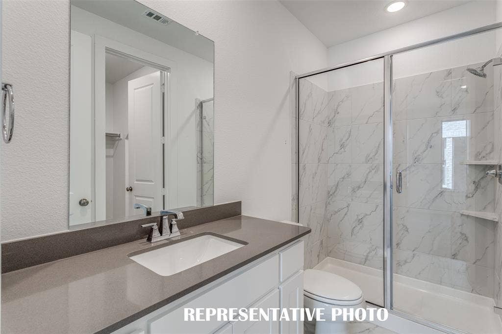Guests will love getting ready in any of the gorgeous guest baths featured in this outstanding home!  REPRESENTATIVE PHOTO