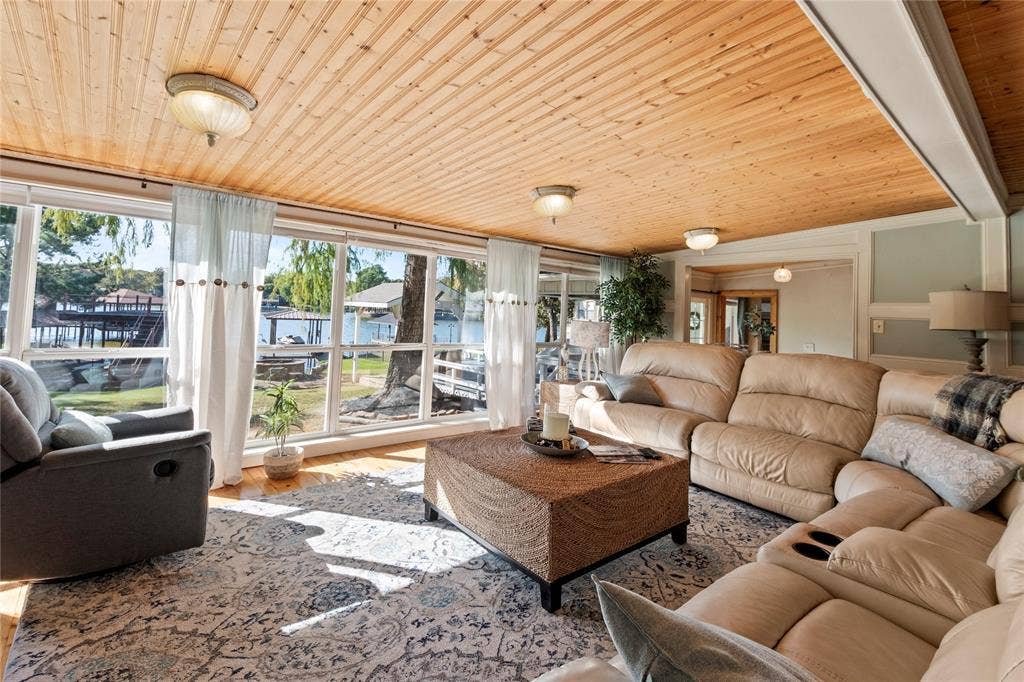 230 Bushwhacker Drive, Mabank, TX 75156 Wood-plank ceiling, wall-to-wall windows, and flush-mount lighting fixtures