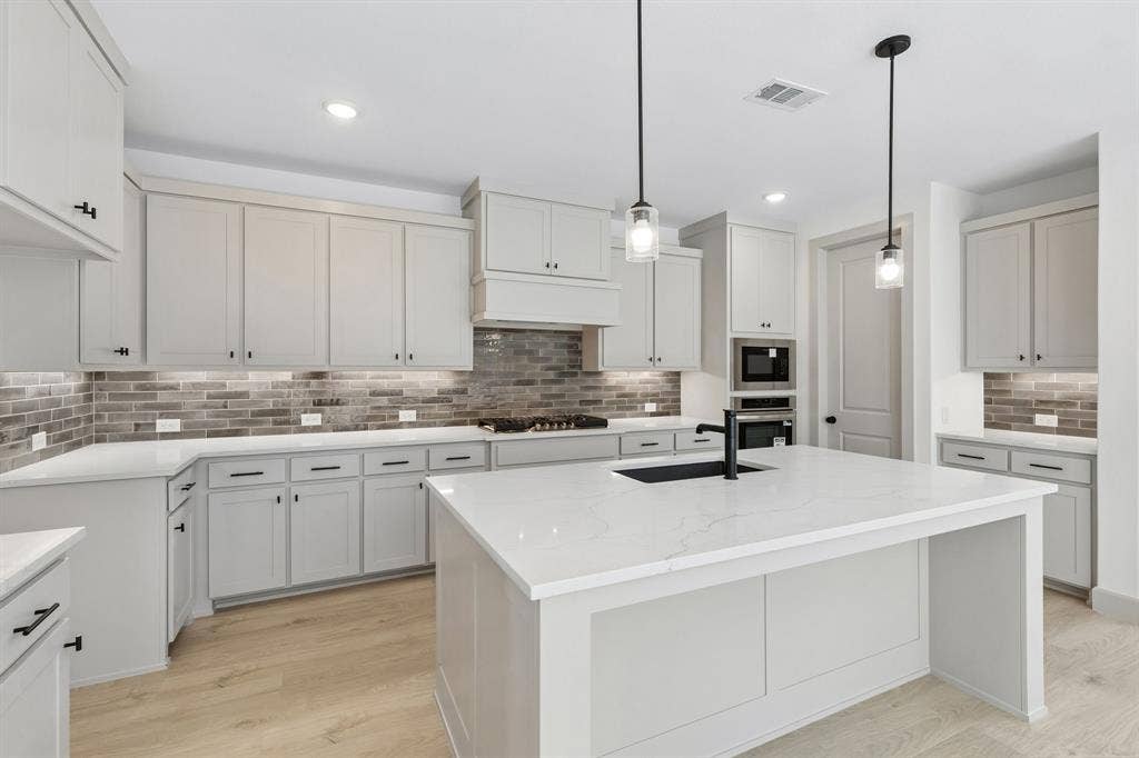 The chef in the family will never be left out of the party in this wonderful home!