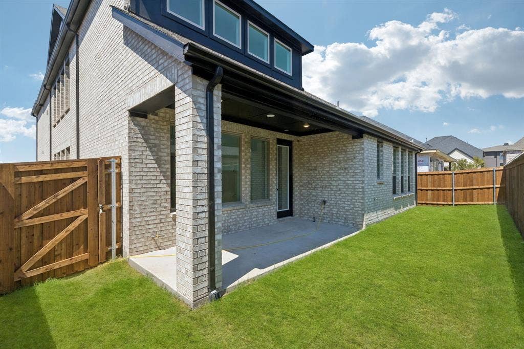With a fenced back yard and lovely covered patio, the entire family will enjoy endless hours of summer time fun in this dream home!