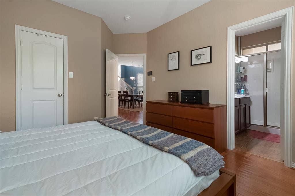 Wood-finish flooring, solid-core interior doors, and neutral wall tones