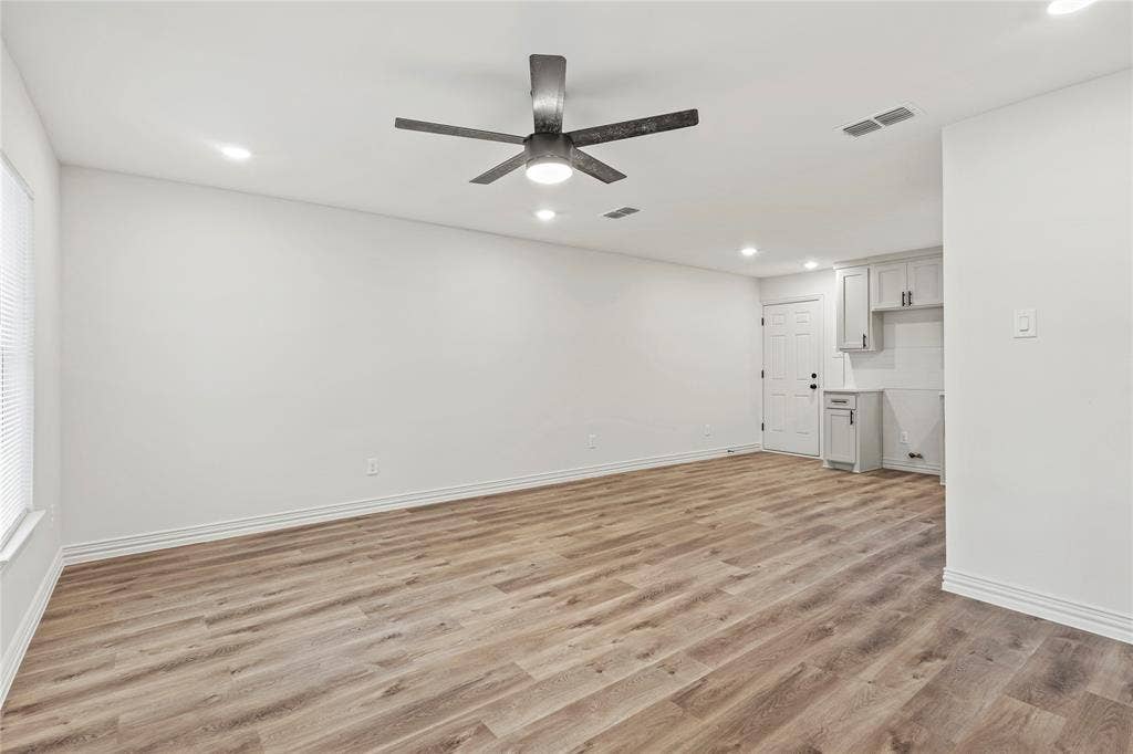 Unfurnished living room with recessed lighting, light wood finished floors, baseboards, and ceiling fan