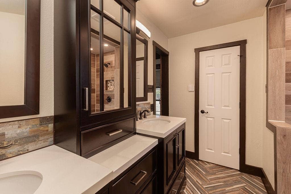 1158 County Road 141, Kaufman, TX 75142 The primary bathroom vanity has 2 sinks and plenty of storage.