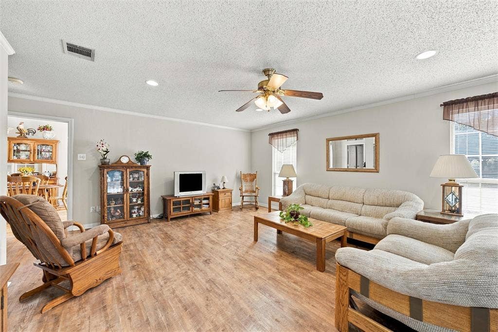 5030 Bosque Ridge Road, Crawford, TX 76638 Living area featuring wood-finish flooring, recessed lighting, and a central ceiling fan with integrated light fixture