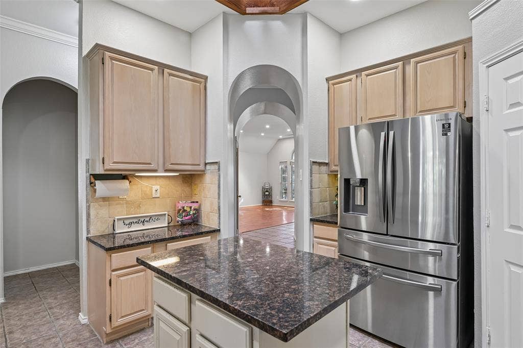 3837 Pine Valley Drive, Plano, TX 75025 Kitchen featuring light wood cabinetry, granite counters, coffee bar and built in work area