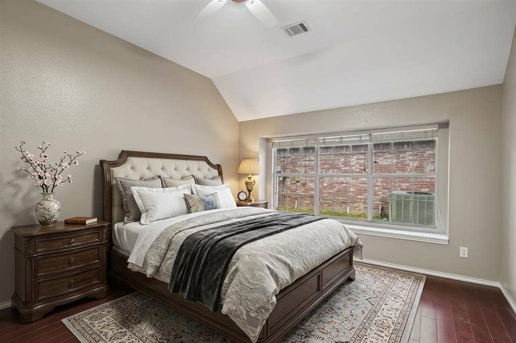 3837 Pine Valley Drive, Plano, TX 75025 Vaulted ceilings, expansive multi-pane window, and wood-finish flooring