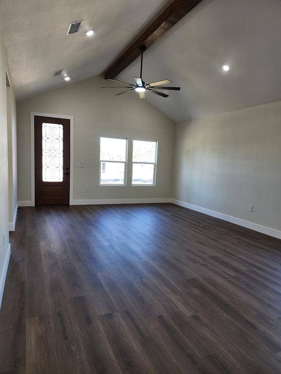 Vaulted ceiling featuring a decorative wood-finish beam, wood-finish flooring, recessed lighting, a modern ceiling fan, and an entry door with an ornamental glass insert