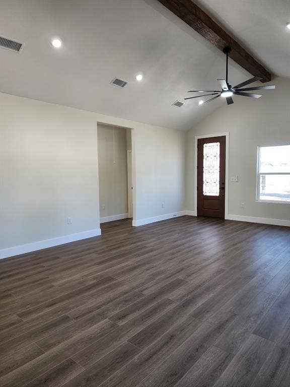 Vaulted ceiling featuring an exposed wood beam, wood-finish flooring, recessed lighting, ceiling fan with integrated light, and an entry door with decorative glass inlay
