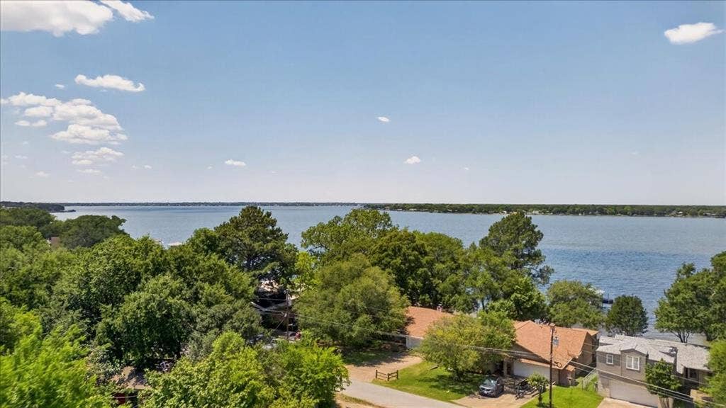 10118 Lakeview Street, Payne Springs, TX 75156 Waterfront property featuring extensive shoreline, mature trees, and paved driveway access