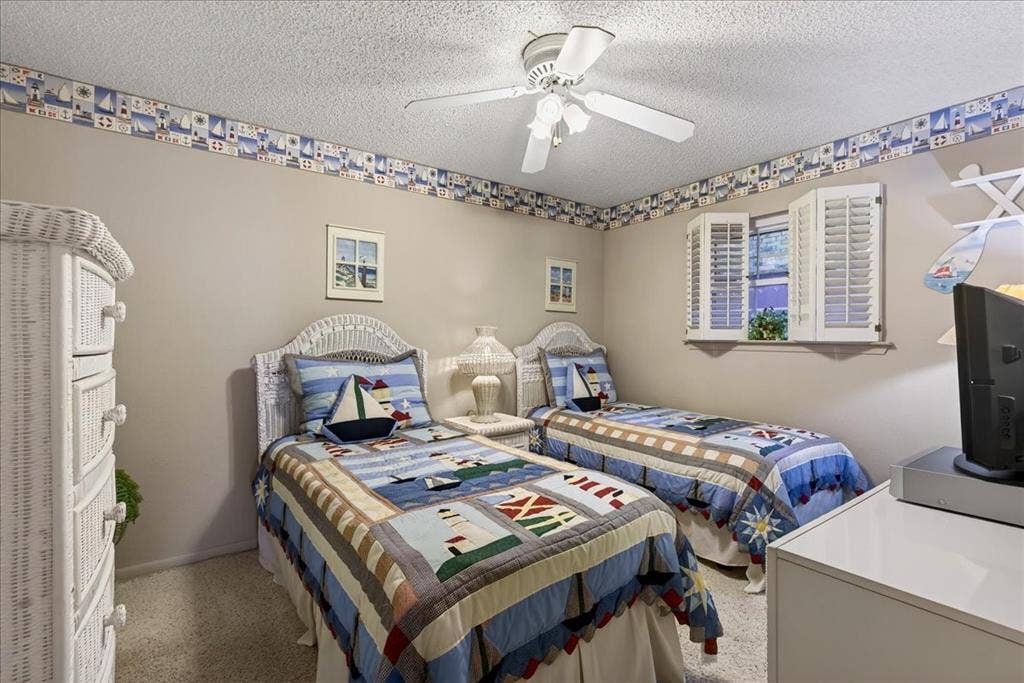 10118 Lakeview Street, Payne Springs, TX 75156 Carpeted flooring, ceiling fan with integrated lighting, and operable shutter window treatments
