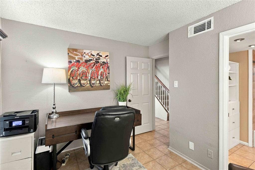 18240 Midway Road, #1706, Dallas, TX 75287 Ceramic tile flooring, six-panel interior door, and built-in storage cabinetry