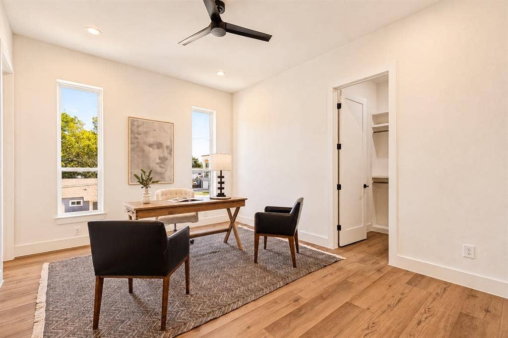 Wood-finish flooring, recessed lighting, and a modern ceiling fan