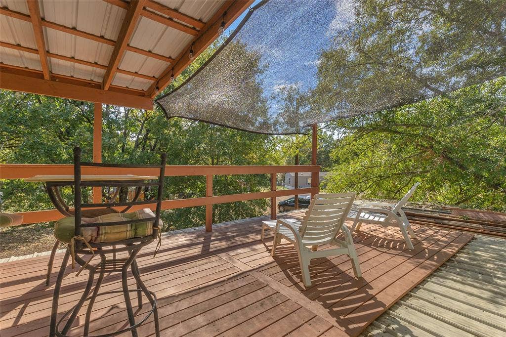 131 Baff Bay Drive, Gun Barrel City, TX 75156 Upper deck with covered seating area and tree views