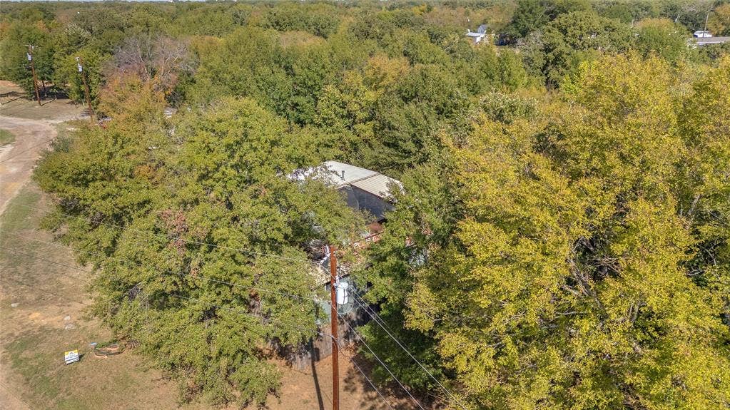 131 Baff Bay Drive, Gun Barrel City, TX 75156 Aerial view of the wooded setting around the home