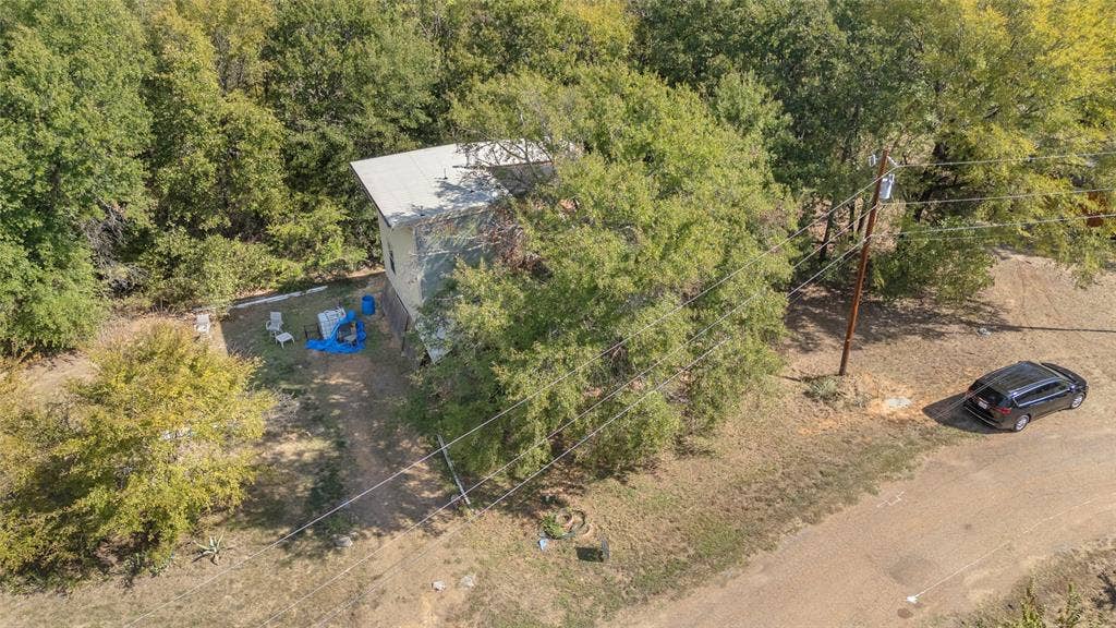 131 Baff Bay Drive, Gun Barrel City, TX 75156 Aerial view of home and tree-covered lot along Baff Bay Dr