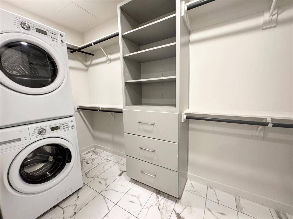Laundry area with stacked washer / dryer