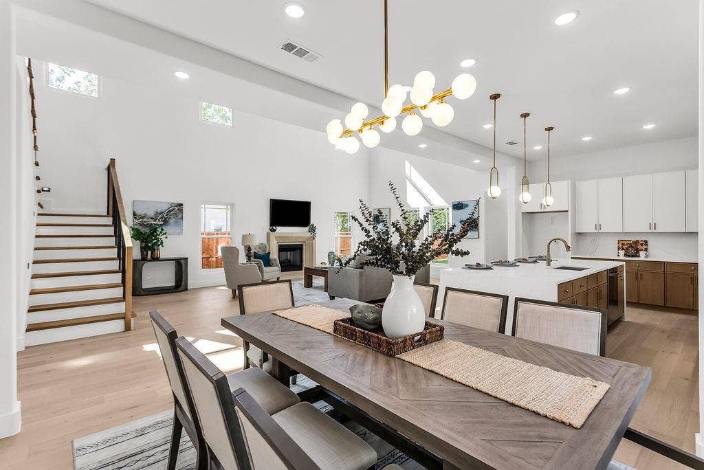 4631 Junius Street, Dallas, TX 75246 Open-concept dining seamlessly connects the kitchen, great room, and covered rear patio