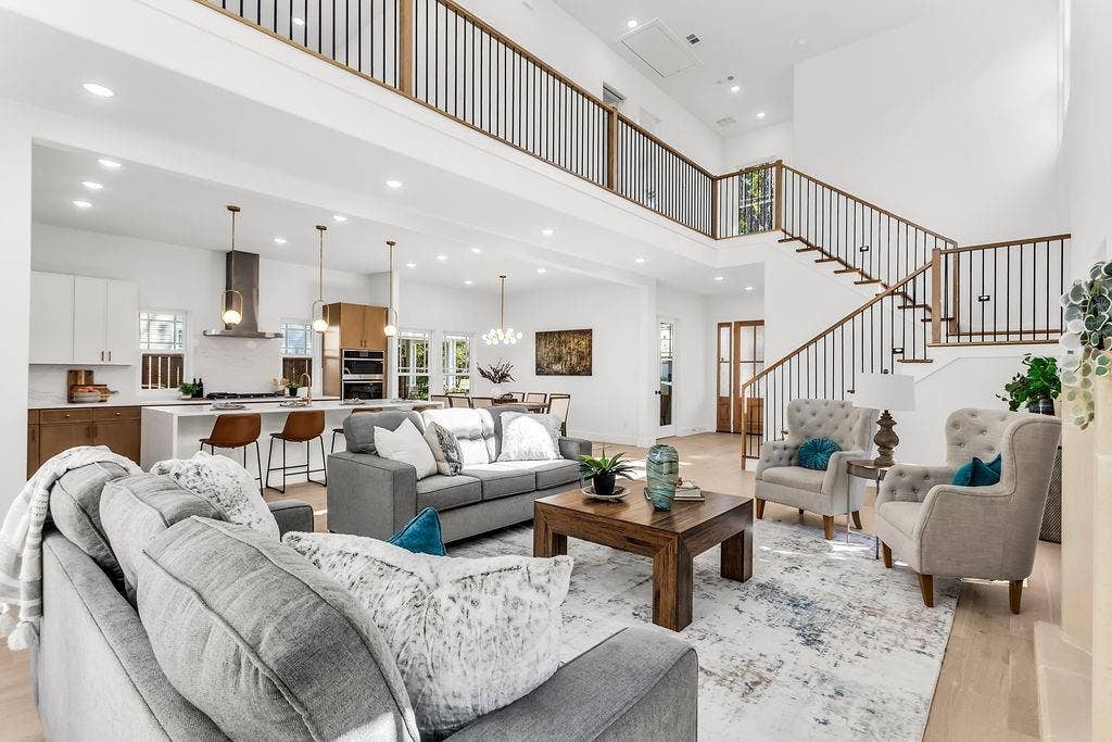 4631 Junius Street, Dallas, TX 75246 Soaring 2-story great room with gas fireplace, clerestory windows, and wide-plank white oak engineered hardwood