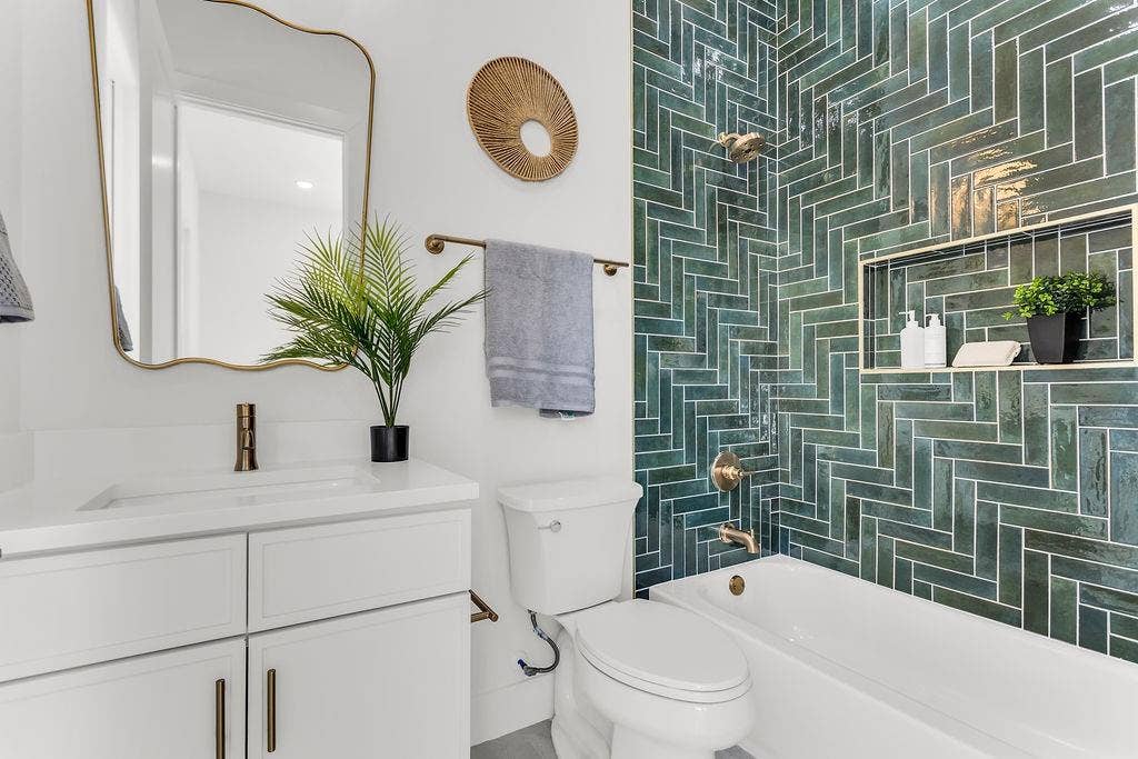 4631 Junius Street, Dallas, TX 75246 Designer full bath with quality tile work and modern fixtures — mirrors the elevated finishes found throughout the home