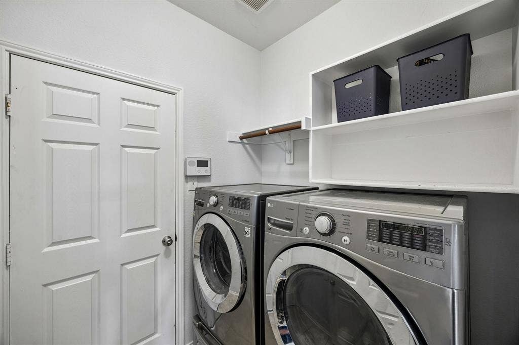 861 Crockett Drive, Lavon, TX 75166 A dedicated laundry area featuring overhead storage shelving and a convenient hanging rod. The efficient layout makes the most of the available space, providing practical storage and organization options to help simplify everyday household routines. Features a full size linen closet for convenient storage.