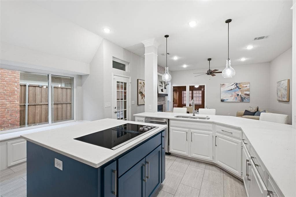 4010 Azure Lane, Addison, TX 75001 Bright, white and wide open. The generous counter space and garden-view windows make weeknight dinners and holiday hosting a pleasure.