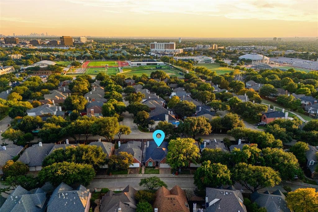 4010 Azure Lane, Addison, TX 75001 An aerial view shows the home’s tree-lined setting, minutes from parks, shopping, the and Tollway.