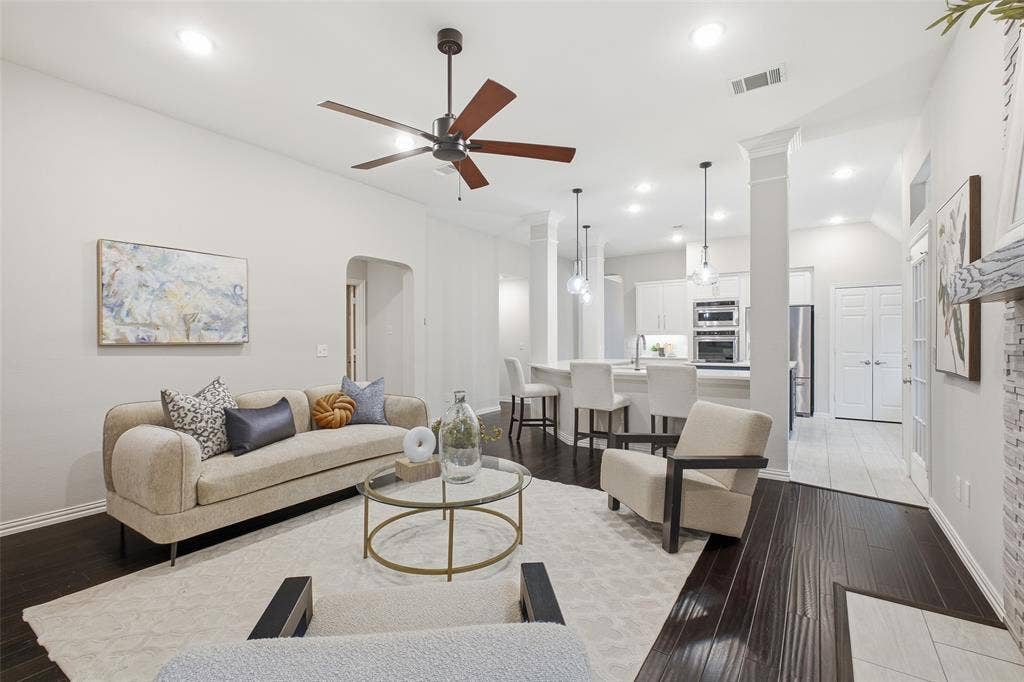 4010 Azure Lane, Addison, TX 75001 Open-concept living at its best. Cook, gather and unwind in one connected space under a modern ceiling fan and soft recessed lighting.