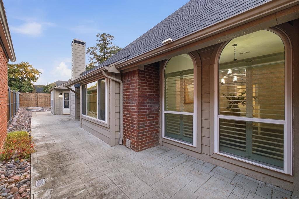 4010 Azure Lane, Addison, TX 75001 A stamped-concrete courtyard wraps the back of the home, giving you private outdoor living right outside your door.