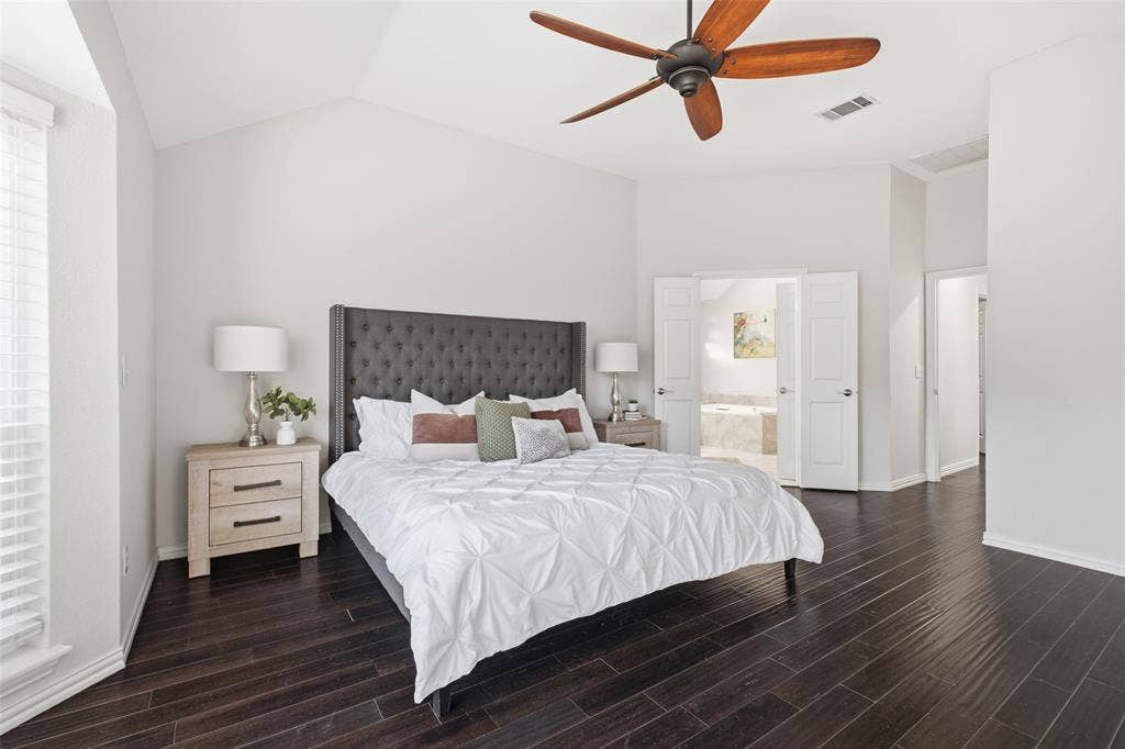 4010 Azure Lane, Addison, TX 75001 Double doors lead from the primary bedroom to a spa-style ensuite. A peaceful end to every day.