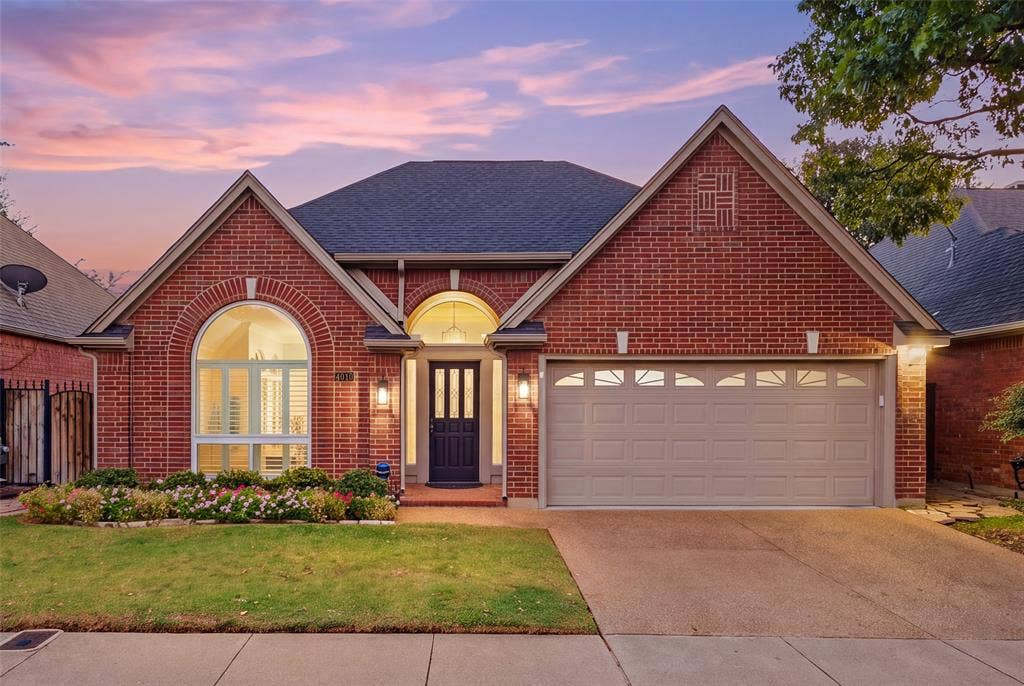 4010 Azure Lane, Addison, TX 75001 Welcome home to 4010 Azure Lane. Classic red brick, arched windows and a glowing entry set the tone for refined Addison living.