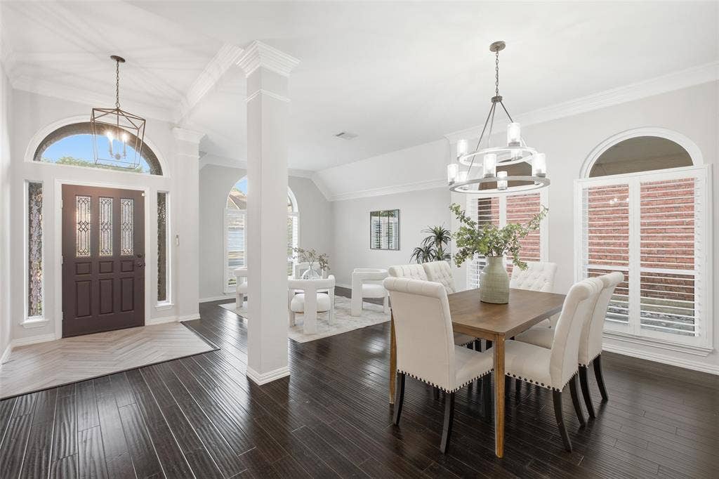 4010 Azure Lane, Addison, TX 75001 Arched transom, leaded-glass front door and a lantern pendant welcome you into a light-filled foyer that opens to the formal dining room.