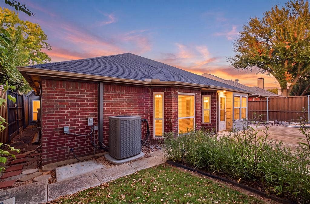 4010 Azure Lane, Addison, TX 75001 Mature trees, lush plantings and classic brick create a peaceful backyard retreat in the heart of Addison.