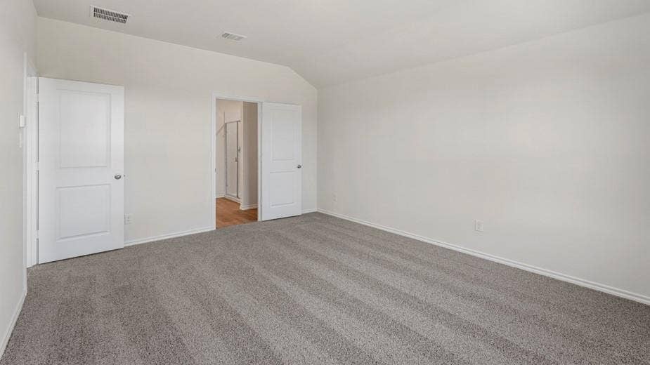 708 Rock Point Road, Josephine, TX 75135 Vaulted ceiling, two paneled doors, light gray carpeting, and light wall finishes