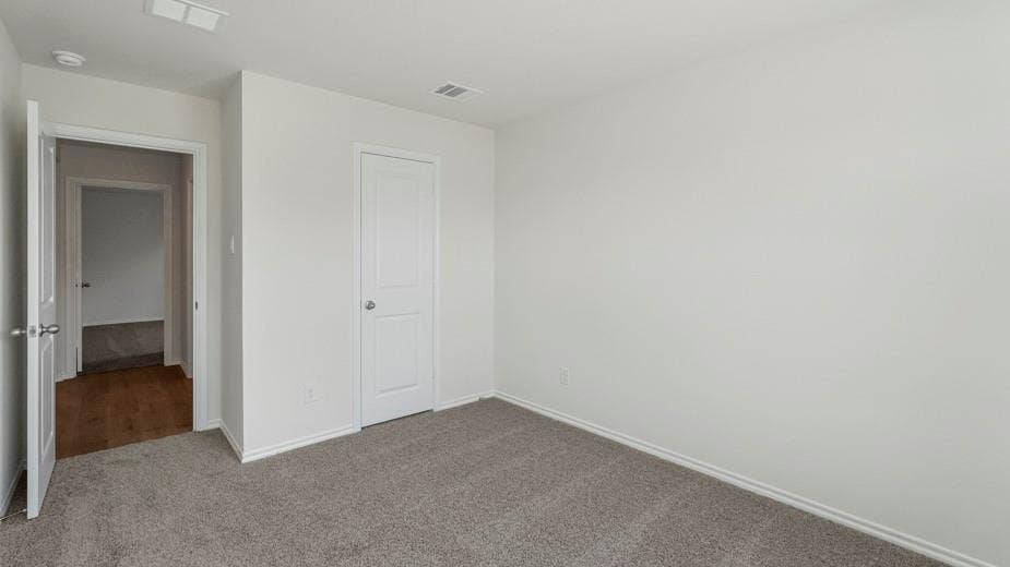 708 Rock Point Road, Josephine, TX 75135 Neutral paint palette, textured carpeting, and white interior doors