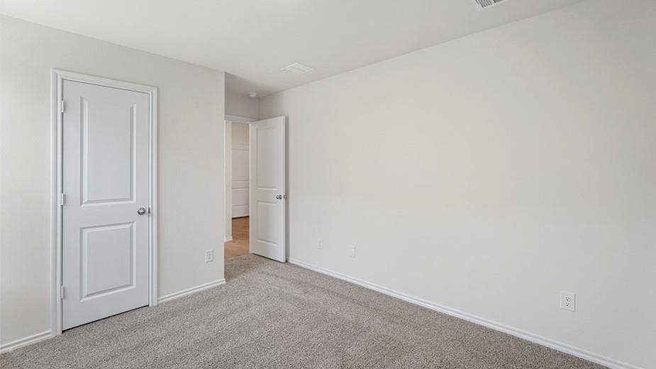 708 Rock Point Road, Josephine, TX 75135 Neutral-toned walls complement plush carpeting